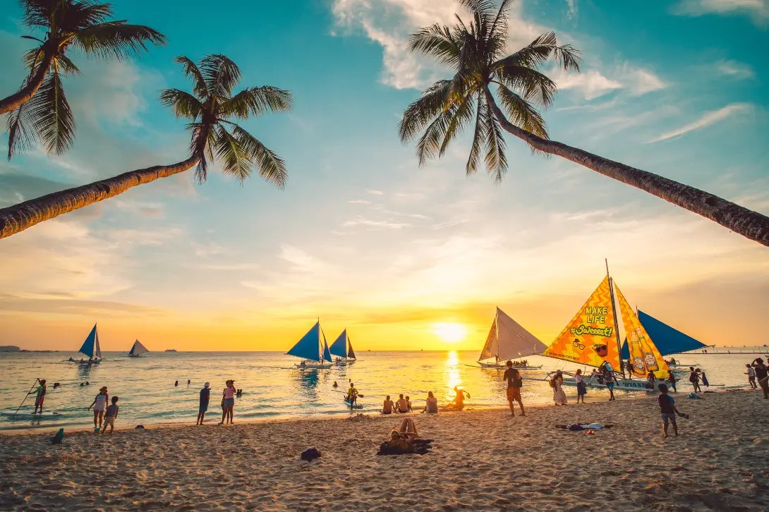 Pristine white sand beach and azure water of Boracay